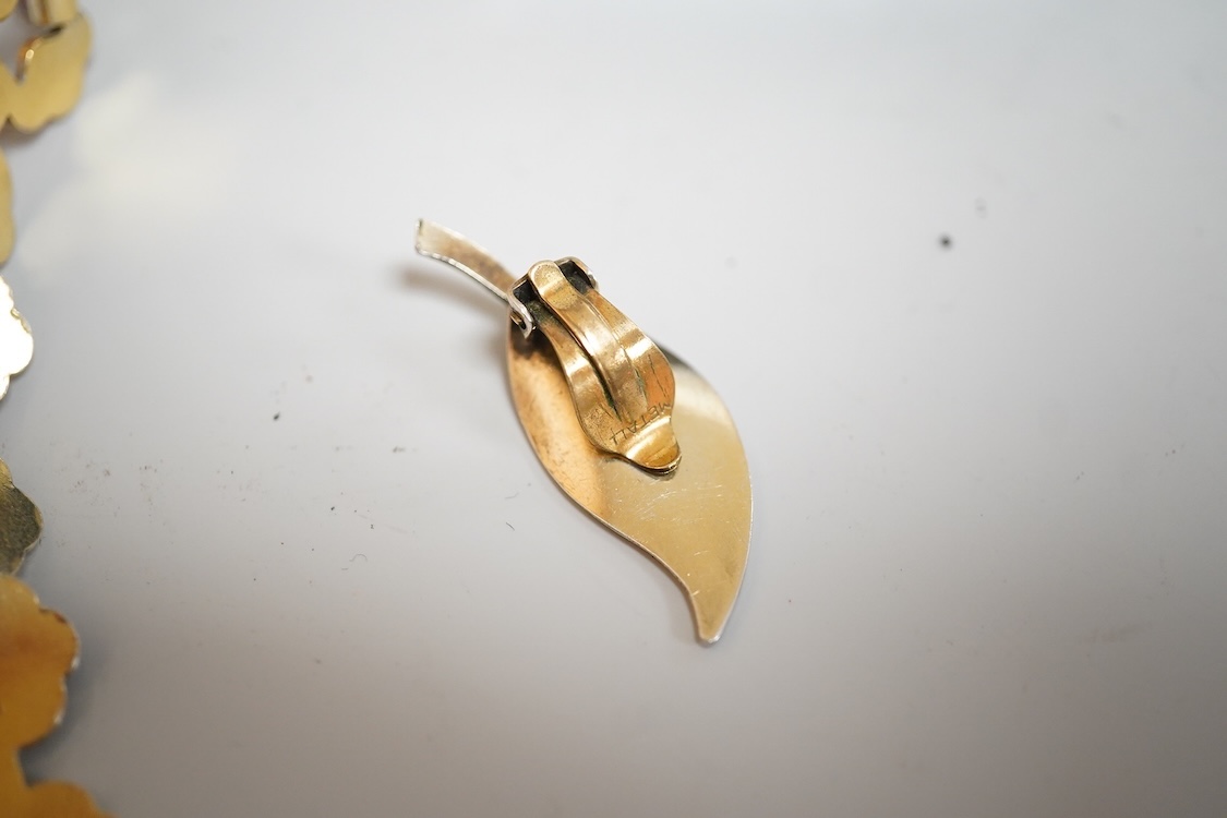 A pair of Norwegian gilt sterling and blue enamel ear clips by David Andersen, 31mm, together with one other Norwegian 925S and blue enamel free form brooch, 47mm and a gilt 925S and red enamel set necklace, 39.5cm.